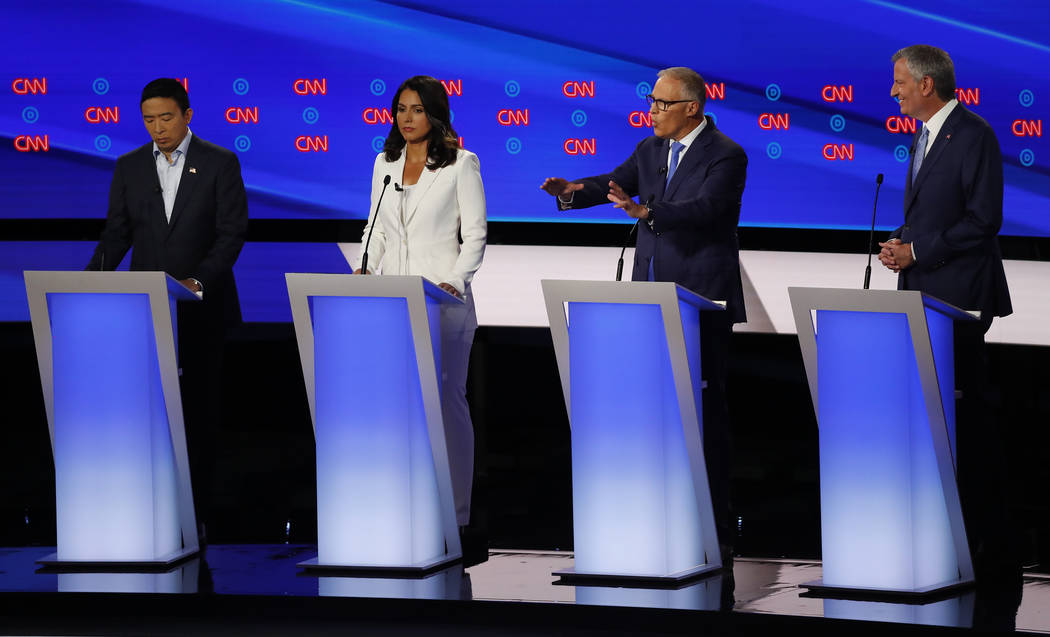 From left, Andrew Yang, Rep. Tulsi Gabbard, D-Hawaii, Washington Gov. Jay Inslee and New York C ...