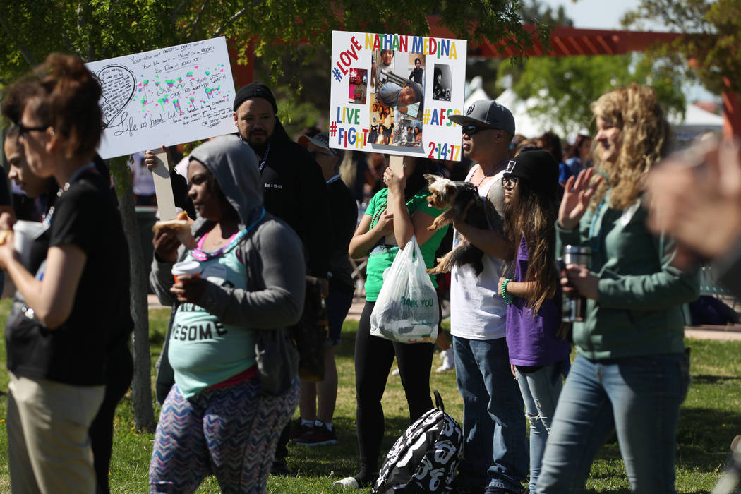 People participate during the Out of the Darkness Suicide Prevention Walk at Craig Ranch Park i ...