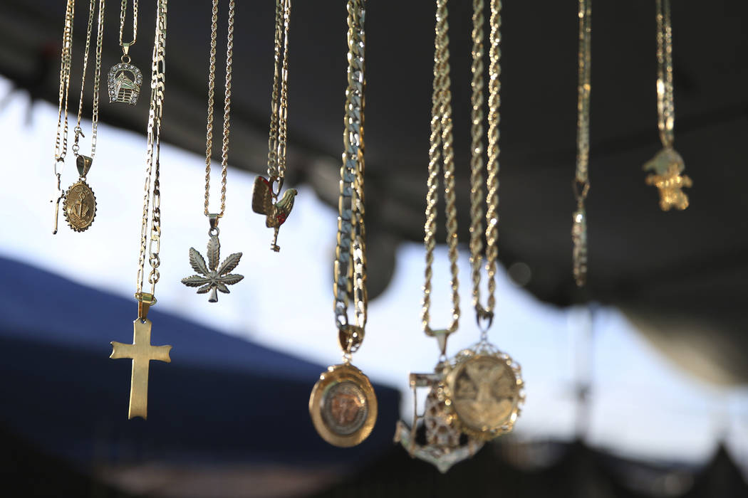 Jewelry hands from a booth at the Broadacres Marketplace in North Las Vegas, Friday, March 22, ...