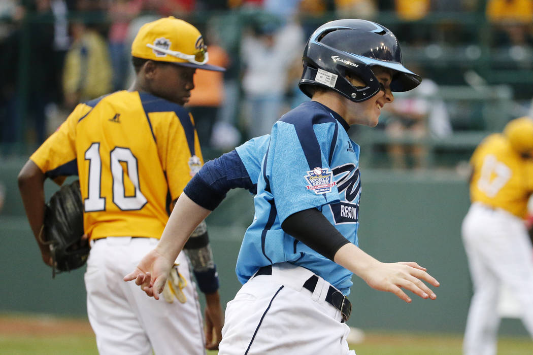 Las Vegas' Brad Stone rounds third past Chicago's Cameron Bufford (10) after hitting a two-run ...