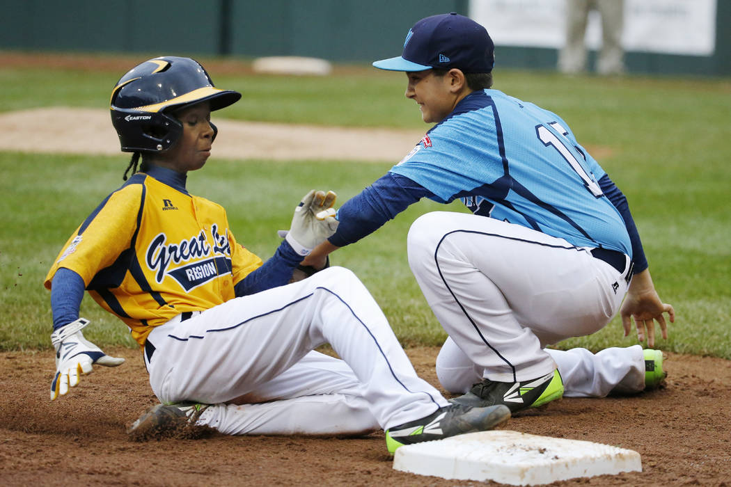 Chicago's Jaheim Benton, left, slides safely into third ahead of the tag by Las Vegas' Dillon J ...