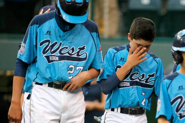 Las Vegas' Brennan Holligan (27), and Josiah Cromwick (7) walk off the field after a 7-5 loss t ...