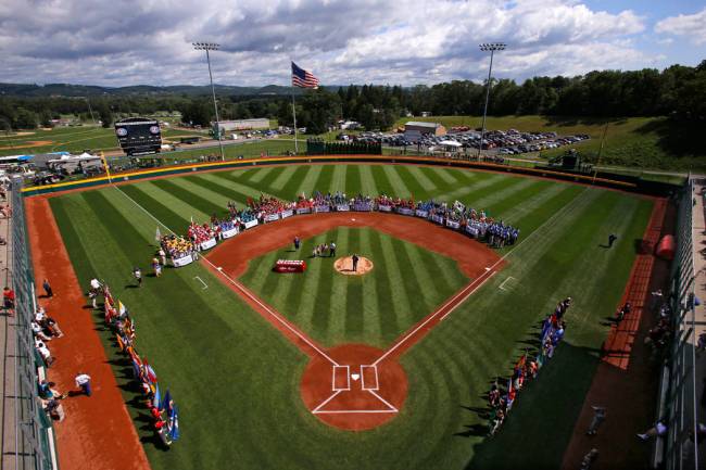 The 16 Little League baseball teams from around the world line the field at Volunteer Stadium d ...