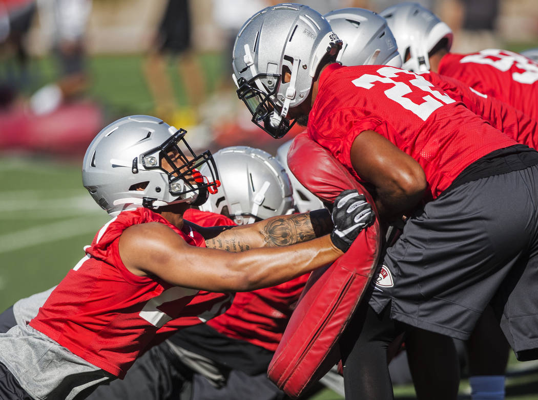 UNLV defensive back Demitrious Gibbs (22) works through a drill with defensive back Bryce Jacks ...