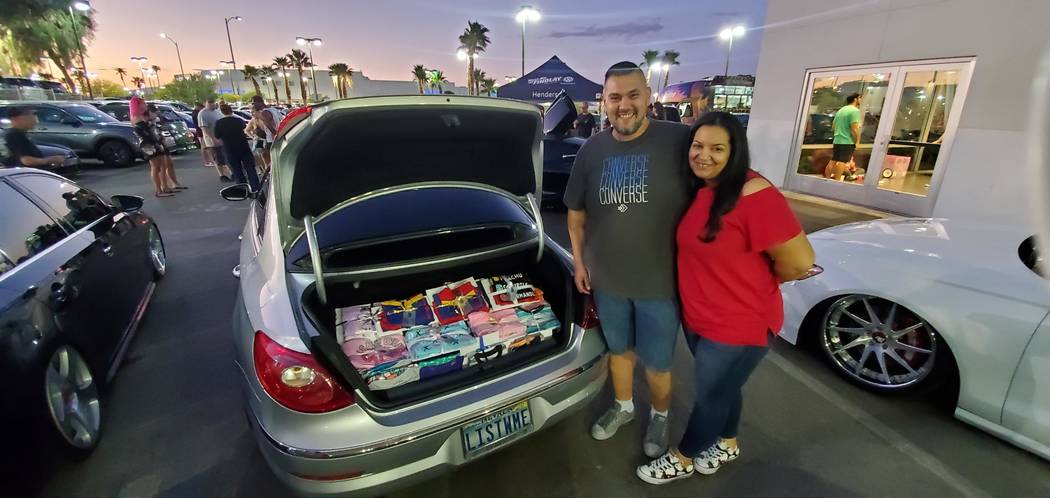 Miguel and Stephanie Landrove made a large donation of pajamas at Findlay Volkswagen in the Val ...