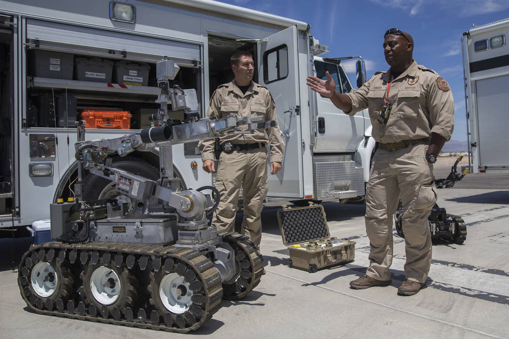 All-Hazard Regional Multi-agency Operations and Response unit officers Wavie Reed, right, and P ...