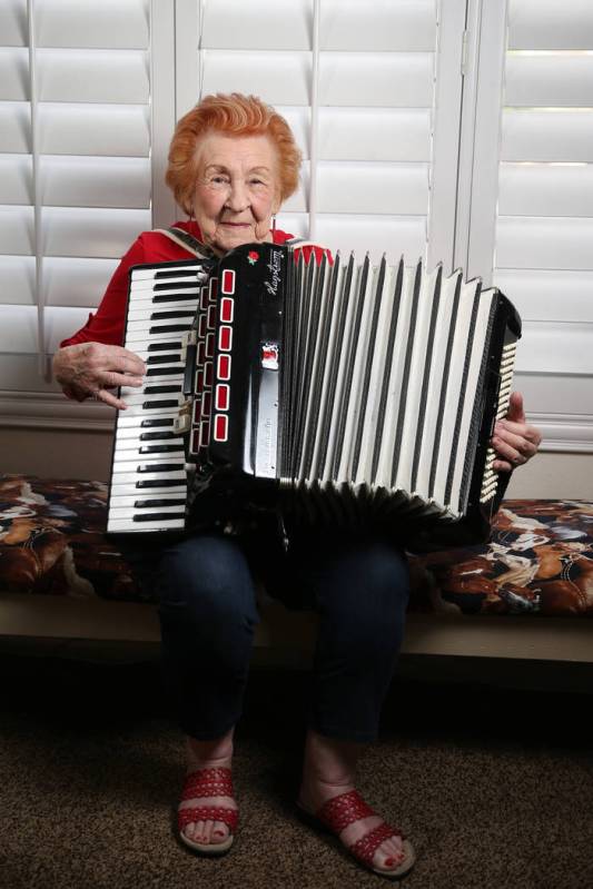 Etta Baykara, 91, plays accordion at her home in Las Vegas, Tuesday, July 30, 2019. Baykara wro ...