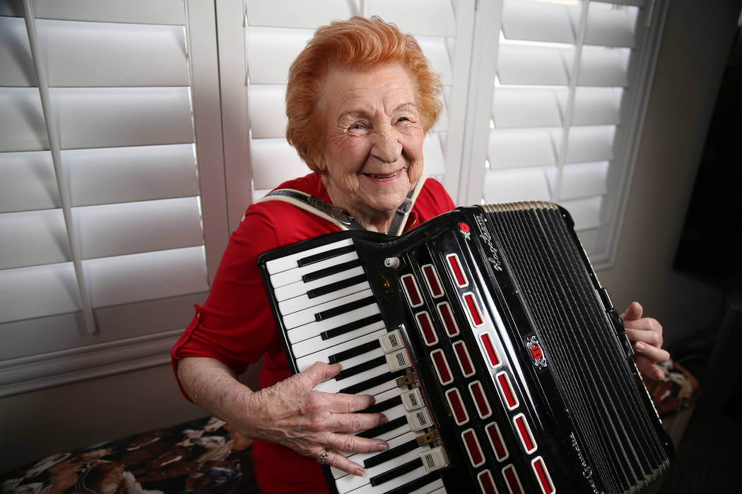 Etta Baykara, 91, plays accordion at her home in Las Vegas, Tuesday, July 30, 2019. Baykara wro ...