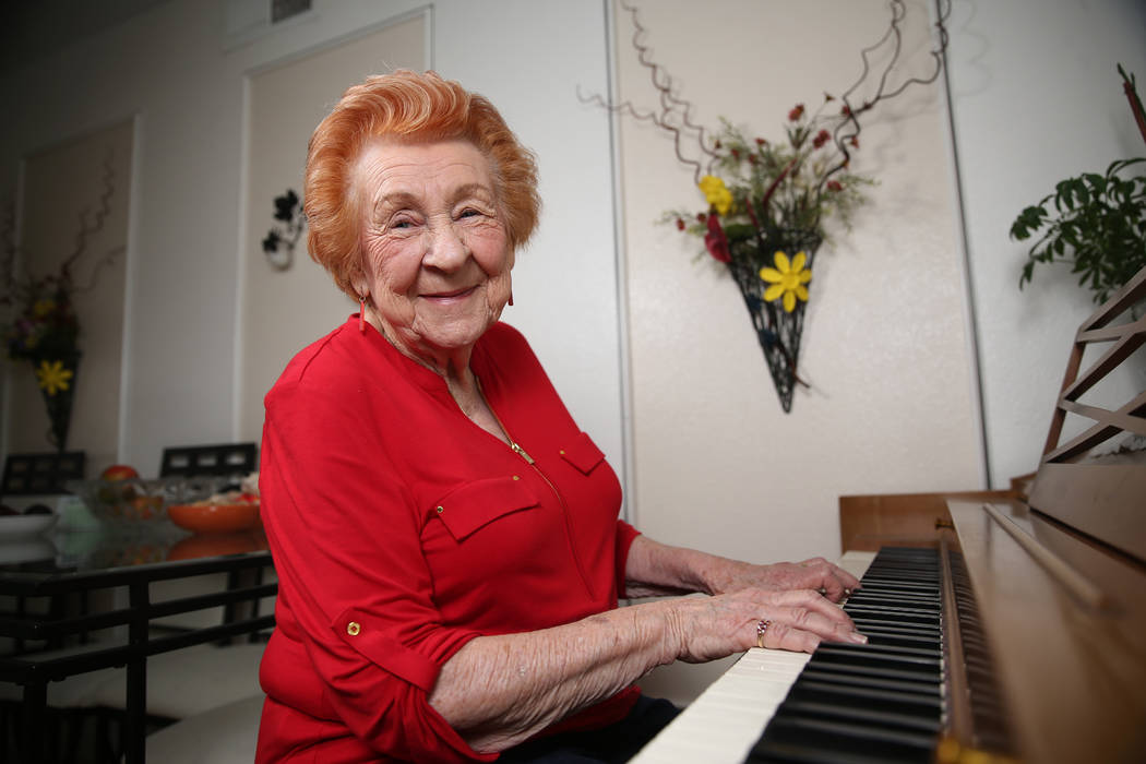Etta Baykara, 91, plays the piano at her home in Las Vegas, Tuesday, July 30, 2019. Baykara wro ...