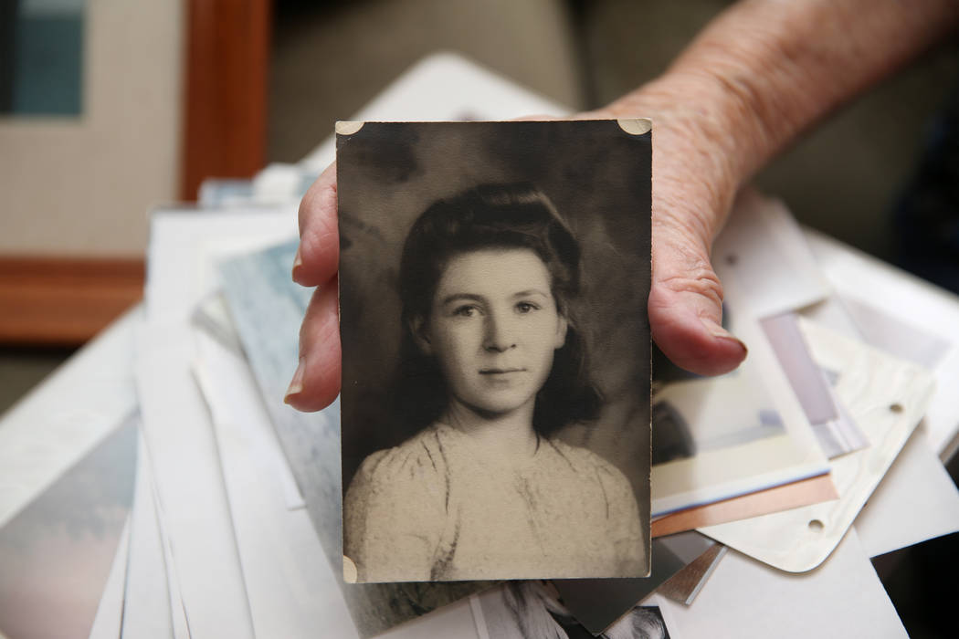 Etta Baykara, 91, shows a picture of herself in the eight grade at her home in Las Vegas, Wedne ...