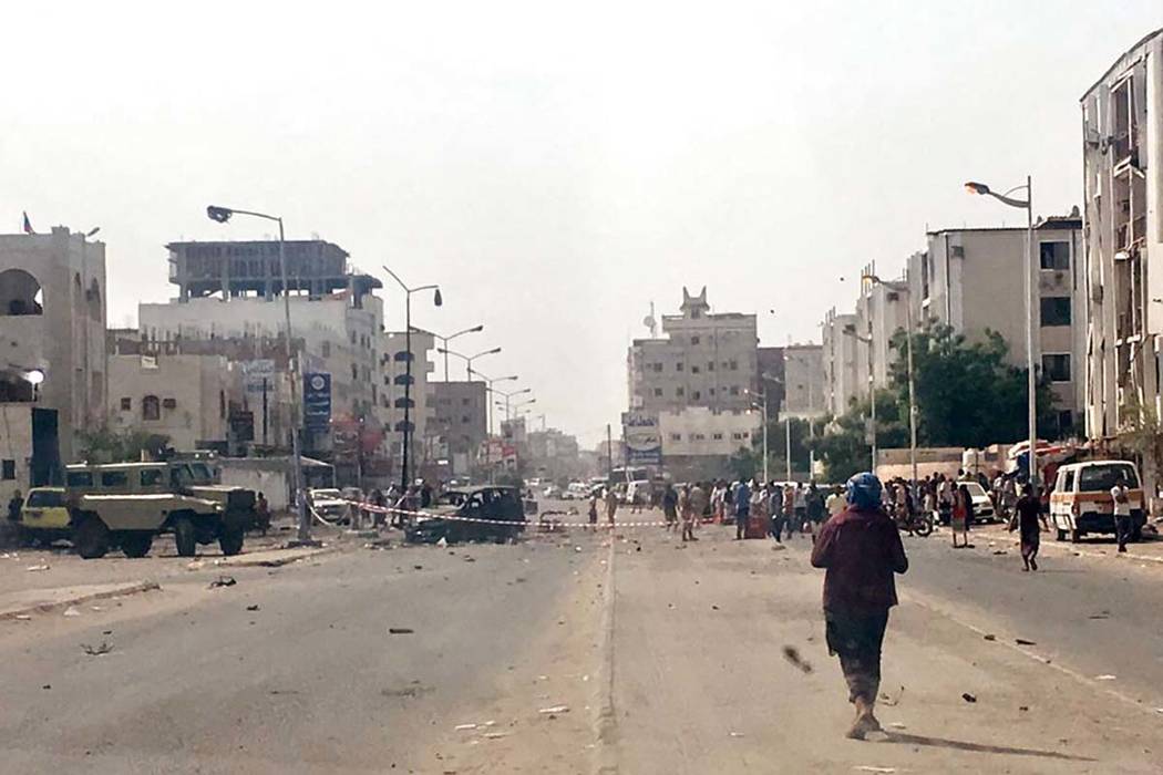 Security forces gather at the site of a deadly attack in Aden, Yemen, Thursday, Aug. 1, 2019. A ...