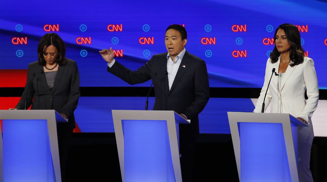 From left, Sen. Kamala Harris, D-Calif., Andrew Yang and Rep. Tulsi Gabbard, D-Hawaii, particip ...