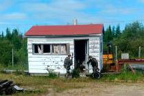 In this recent photo provided by the Royal Canadian Mounted Police, RCMP officers canvas homes ...