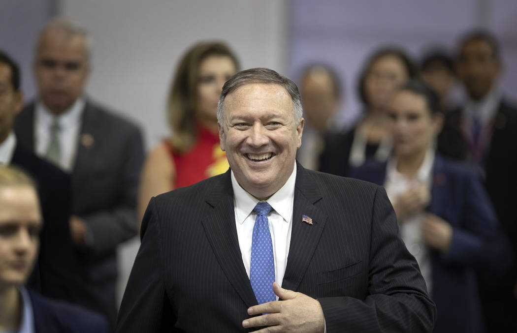 U.S. Secretary of State Mike Pompeo walks to hold a press conference during Association of Sout ...