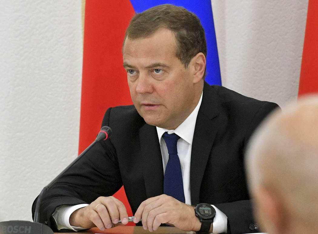 Russian Prime Minister Dmitry Medvedev attends a meeting in Chita, Russia, Thursday, Aug. 1, 20 ...