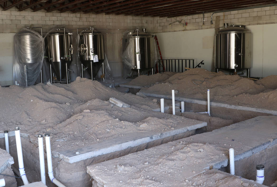 Stainless tanks are seen at the construction site of future brewery on S. Water Street Friday, ...