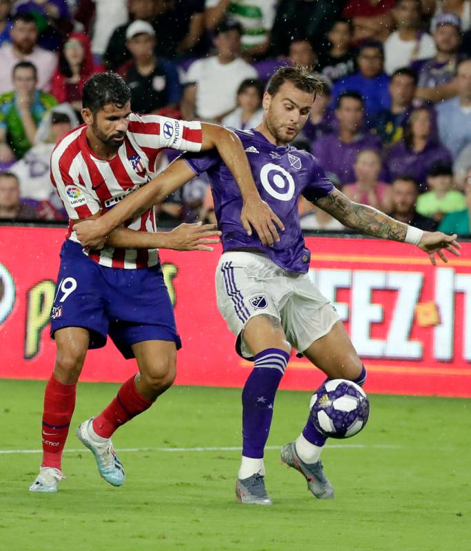 Atlanta United defender Leandro Gonzalez Pirez, right, gets in front of Atletico Madrid forward ...