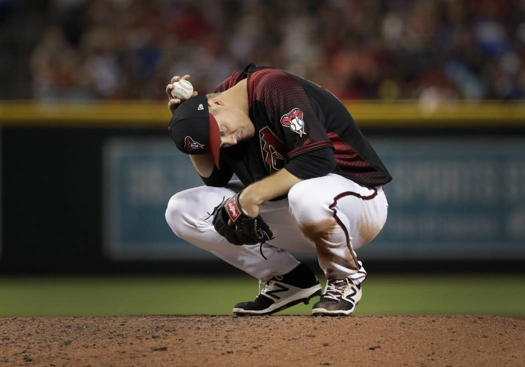 Arizona Diamondbacks starting pitcher Zack Greinke waits to face a hitter during the seventh in ...