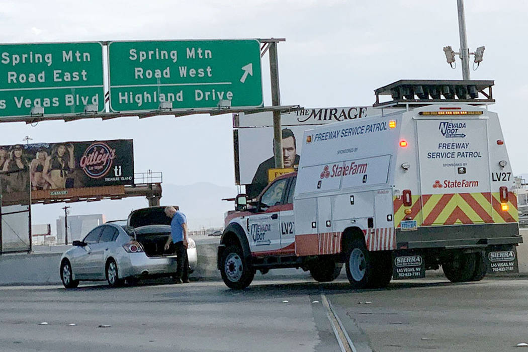 A Freeway Service Patrol member helps a motorist in need on Wednesday, July 31, 2019. (Mick Ake ...