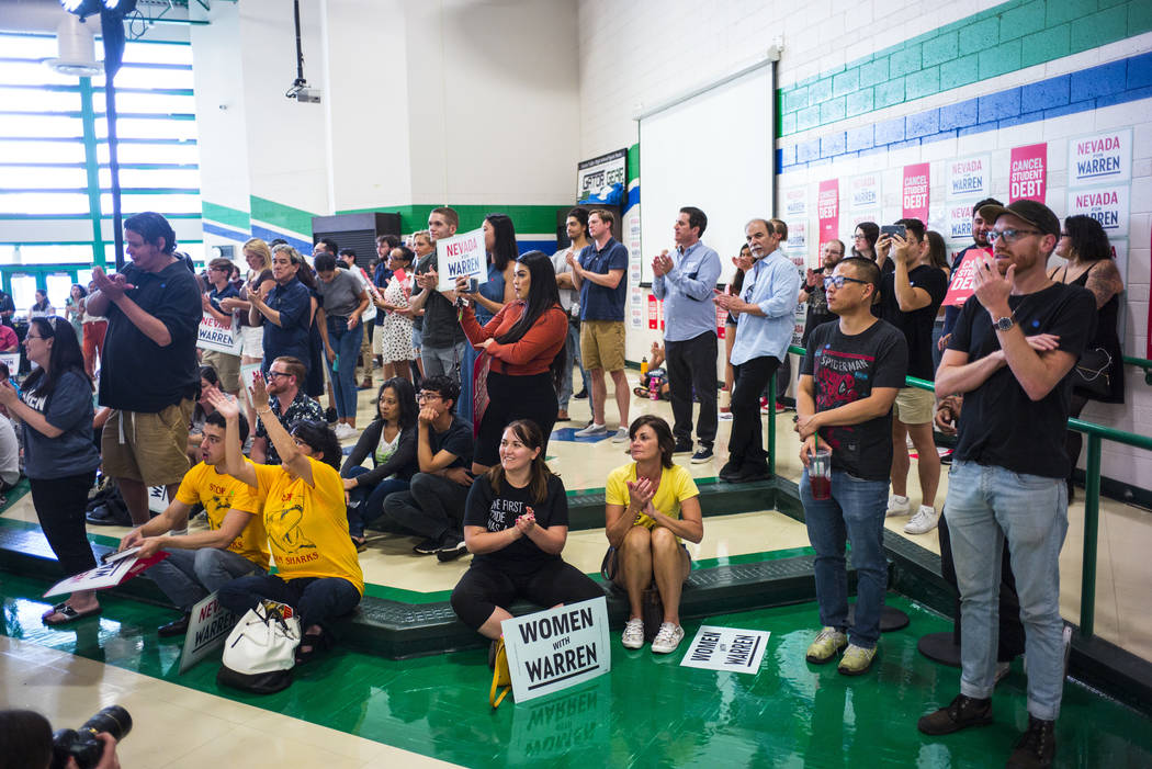 Attendees cheer as Democratic presidential candidate Sen. Elizabeth Warren, D-Mass., not pictur ...