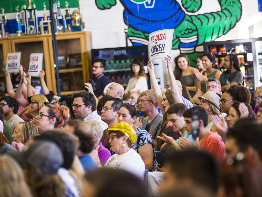 Attendees cheer as Democratic presidential candidate Sen. Elizabeth Warren, D-Mass., not pictur ...