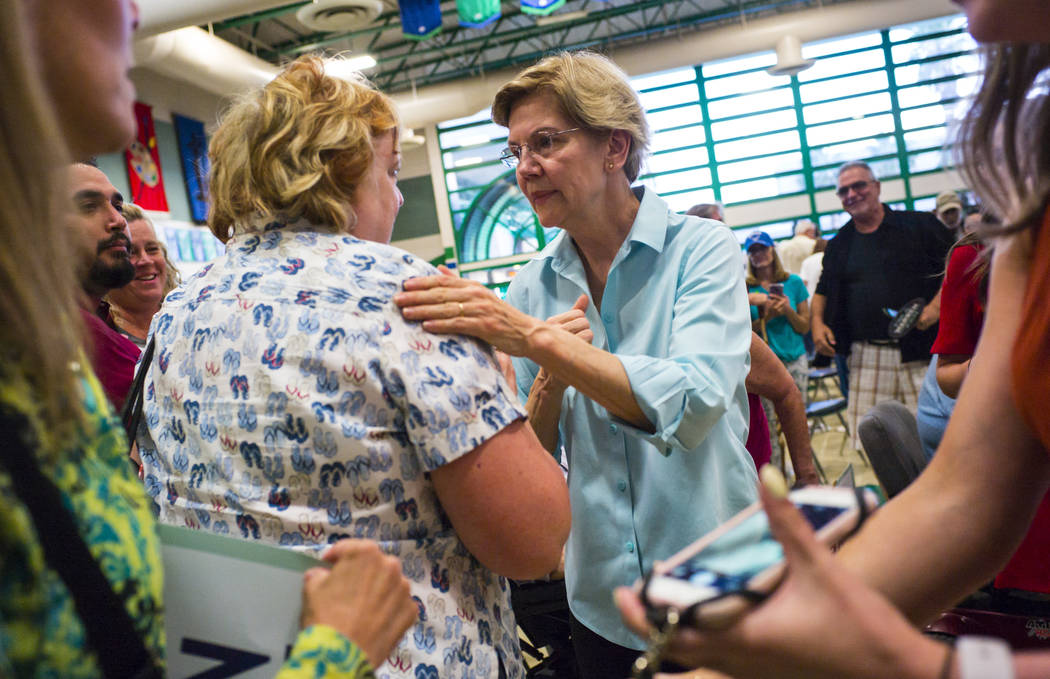 Democratic presidential candidate Sen. Elizabeth Warren, D-Mass., talks with supporters after s ...