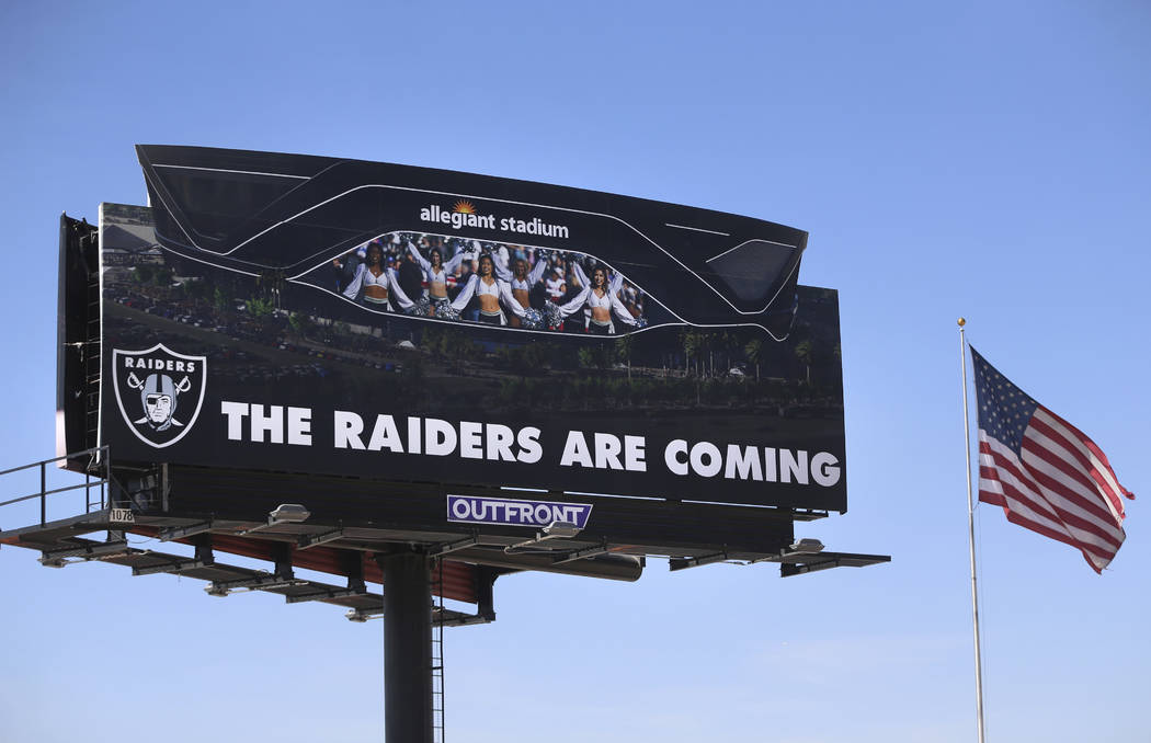 An Allegiant Stadium billboard is unveiled during the Las Vegas Stadium Topping Out Ceremony in ...