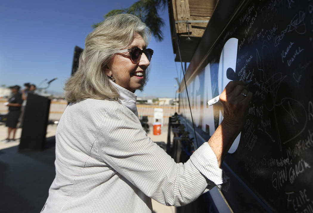 U.S. Rep. Dina Titus, D-Nev., signs a steel beam during the Las Vegas Stadium Topping Out Cerem ...