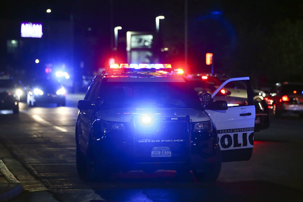 Las Vegas police gather outside of University Medical Center in Las Vegas on Saturday, July 20, ...