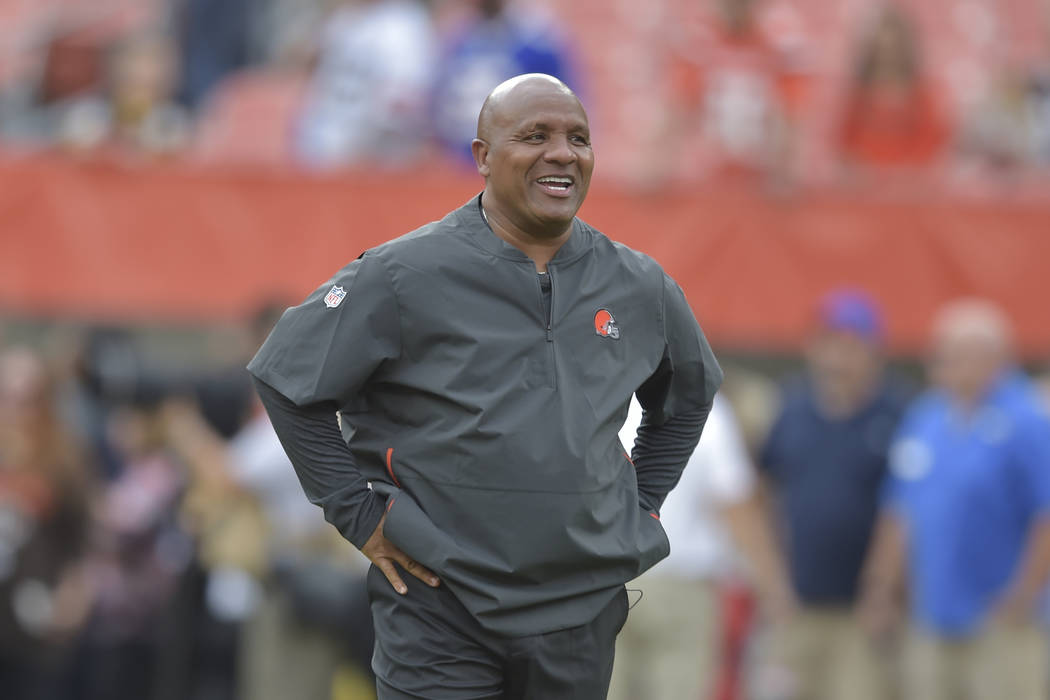 Cleveland Browns head coach Hue Jackson walks on the field before an NFL football preseason gam ...