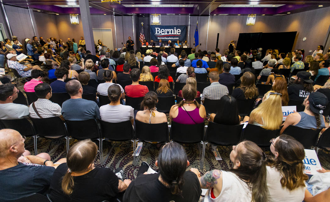 Democratic presidential candidate Sen. Bernie Sanders, I-Vt., speaks beside panel members durin ...