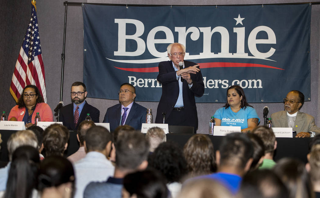 Democratic presidential candidate Sen. Bernie Sanders, I-Vt., center, speaks during an economic ...