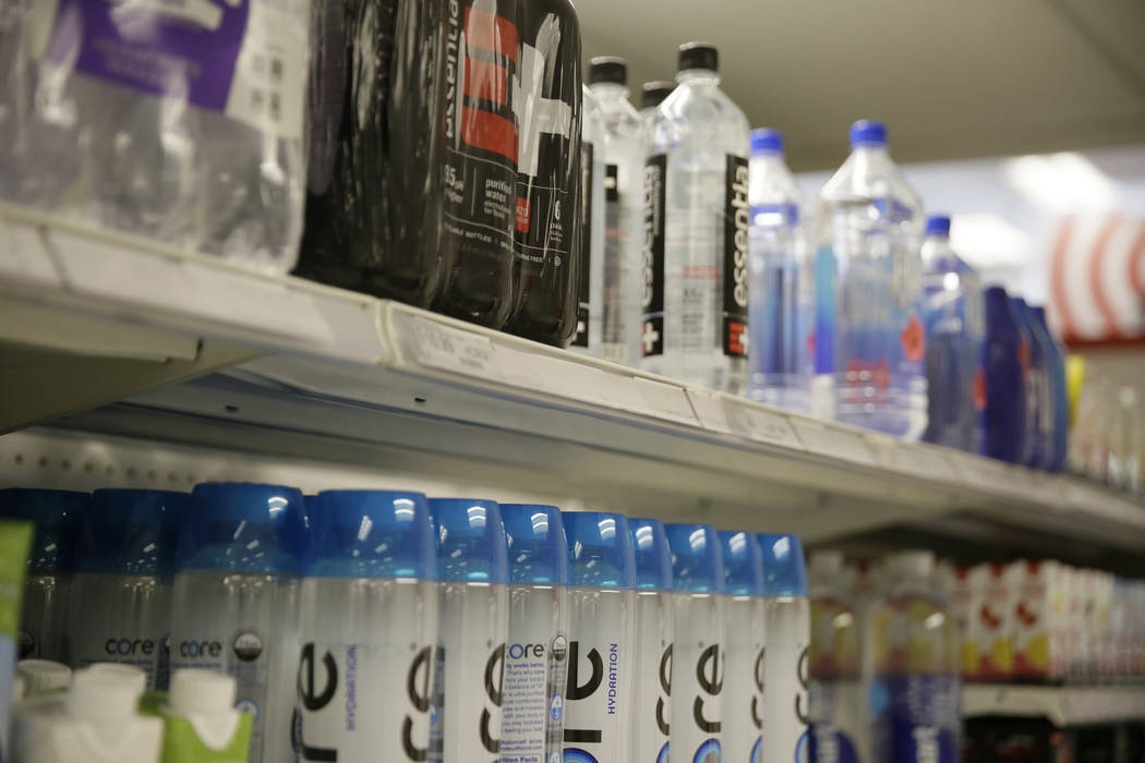 Plastic bottles of water line shelves at a store Friday, Aug. 2, 2019, in San Francisco. San Fr ...