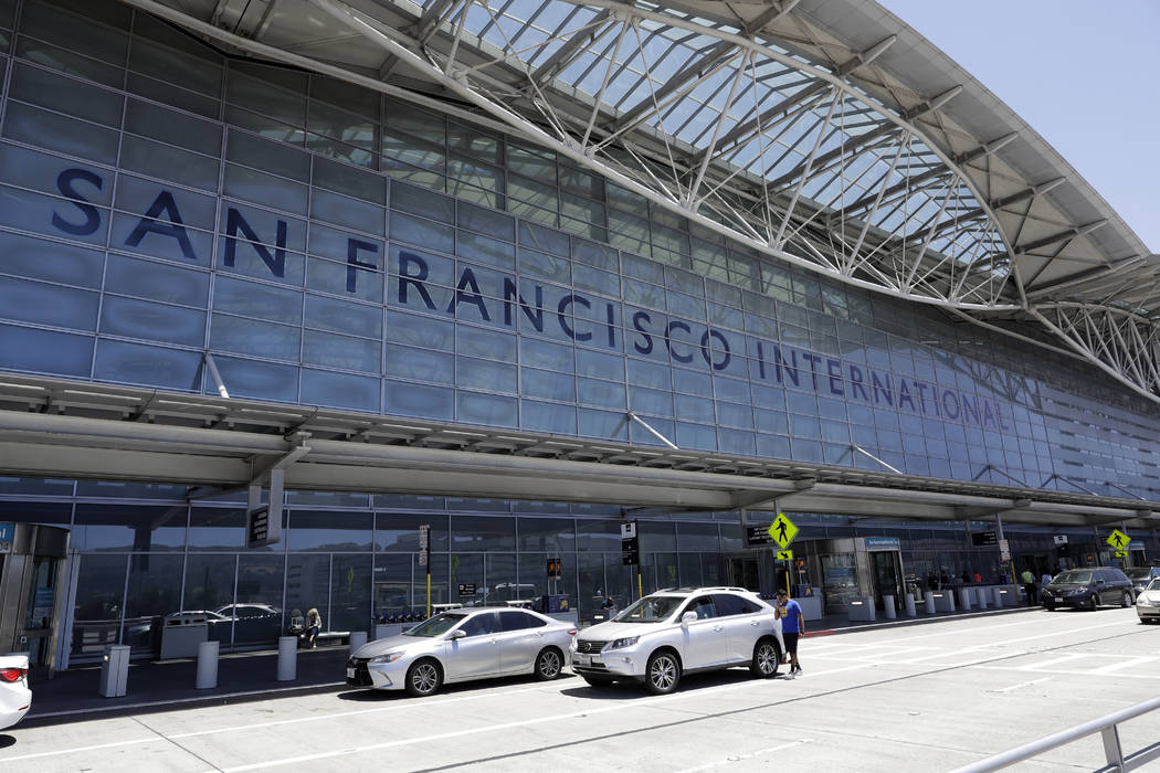 FILE - In this July 11, 2017, file photo, vehicles wait outside the international terminal at S ...