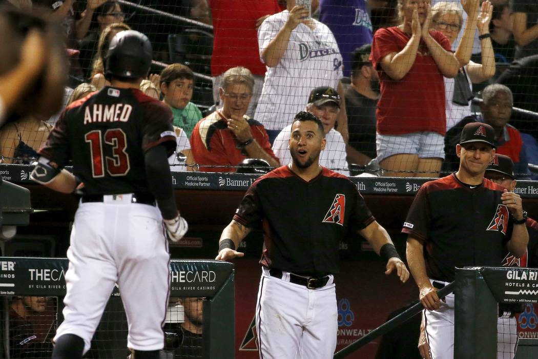 Arizona Diamondbacks shortstop Nick Ahmed (13) arrives back at the dugout after hitting a home ...