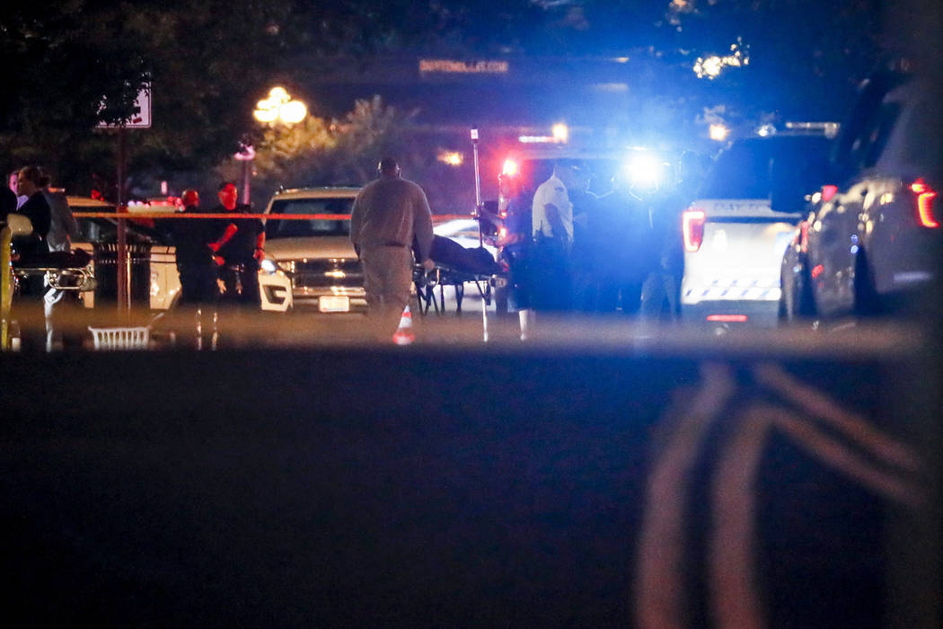 Bodies are removed from at the scene of a mass shooting, Sunday, Aug. 4, 2019, in Dayton, Ohio. ...