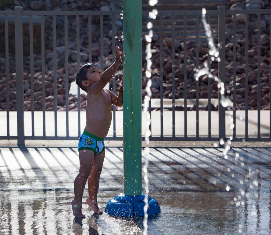 Diego Hernandez, 2, plays at the water park at Lorenzi Park in Las Vegas, Sunday, Aug. 4, 2019. ...