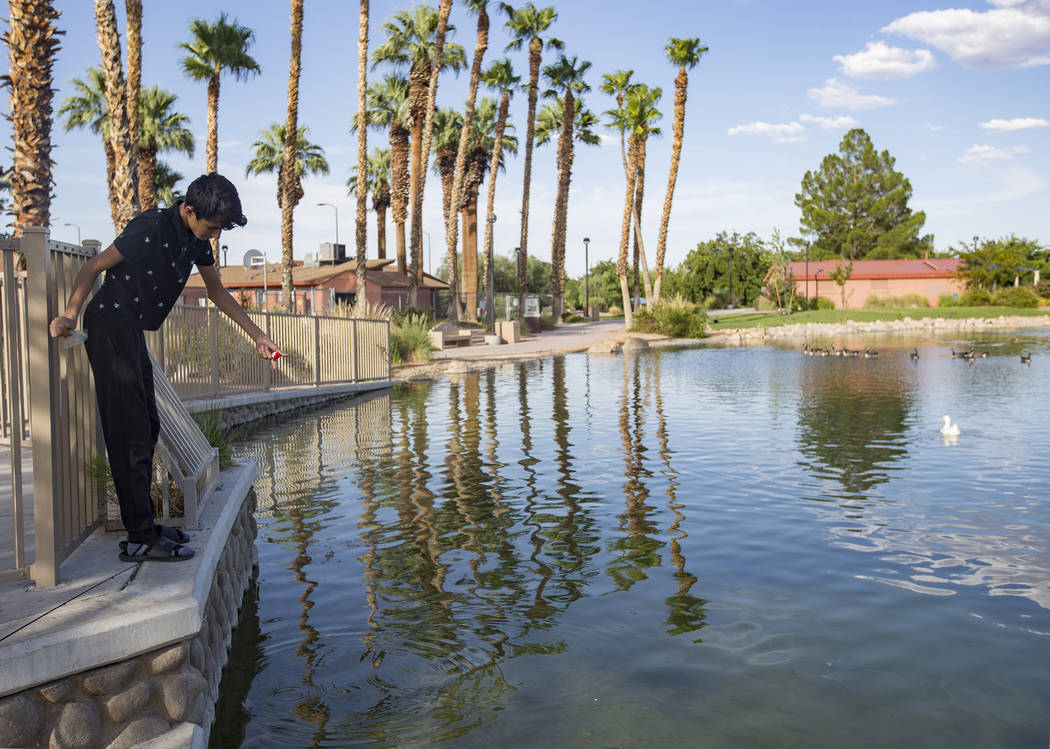Angel Casares, 15, fishes at the pond at Lorenzi Park in Las Vegas, Sunday, Aug. 4, 2019. (Rac ...