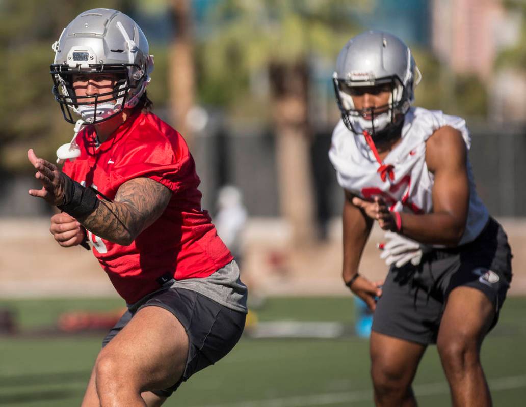 UNLV linebacker Vic Viramontes, left, works through drills during the first day of training cam ...