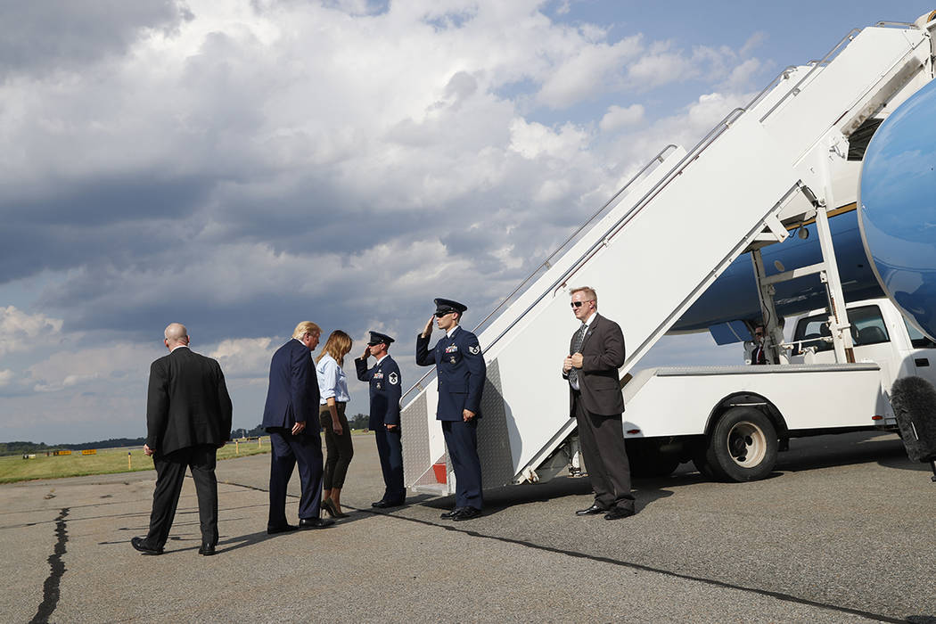 President Donald Trump, with first lady Melania Trump, walks to Air Force One after speaking to ...