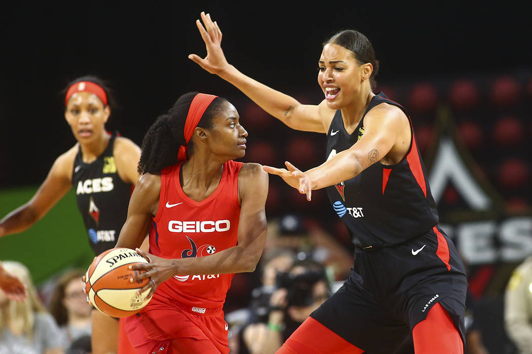 Las Vegas Aces center Liz Cambage (8) guards Washington Mystics forward LaToya Sanders (30) dur ...