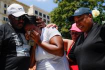 Mourners gather at a vigil following a nearby mass shooting, Sunday, Aug. 4, 2019, in Dayton, O ...