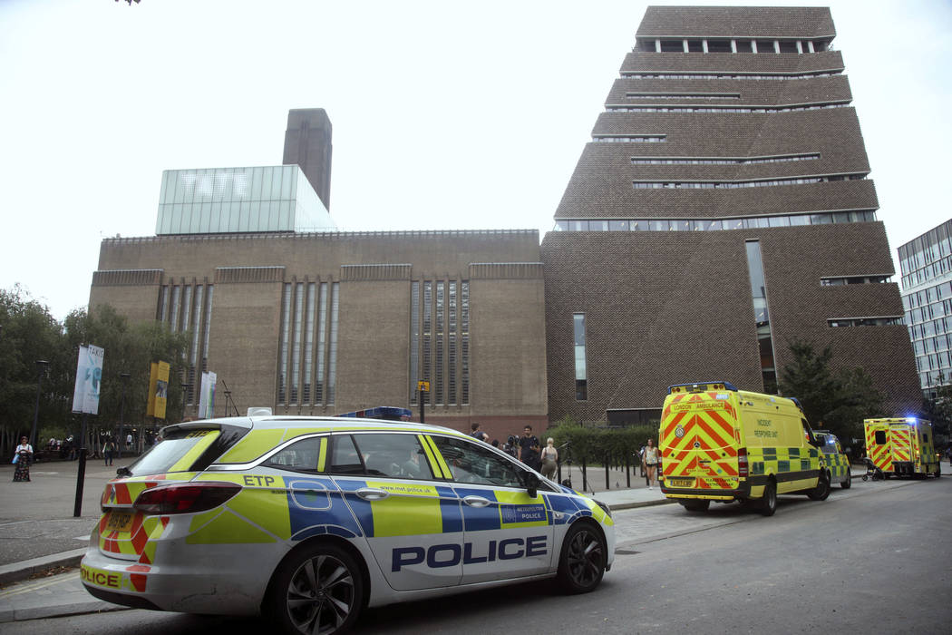 Emergency crews attending a scene at the Tate Modern art gallery, London, Sunday, Aug. 4, 2019. ...