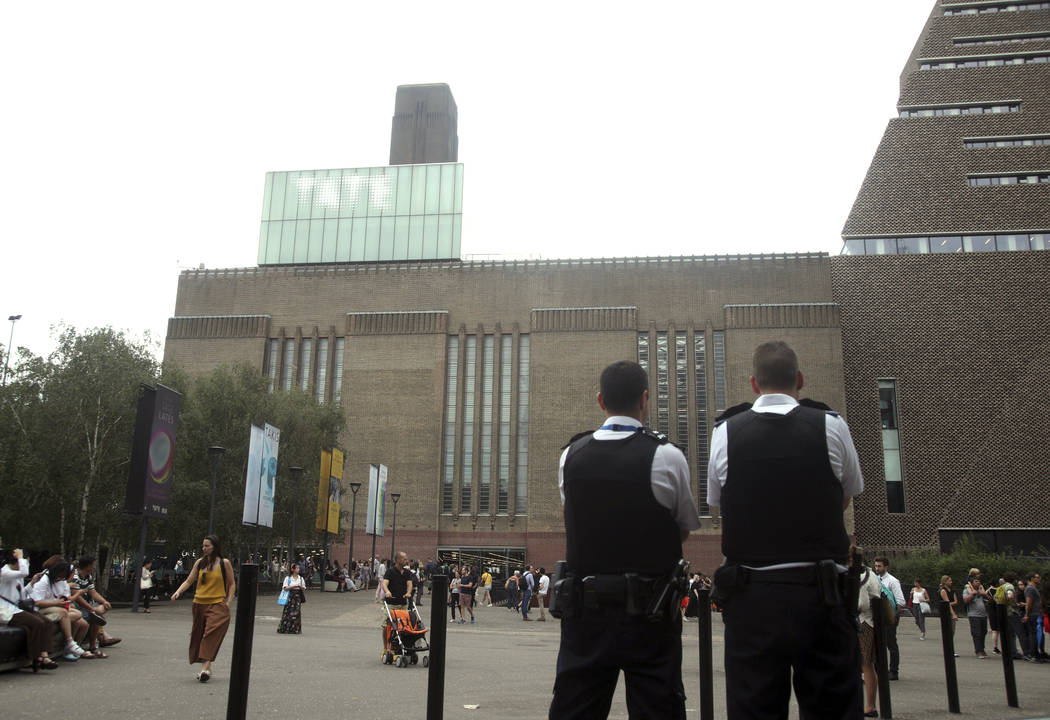 Emergency crews attending a scene at the Tate Modern art gallery, London, Sunday, Aug. 4, 2019. ...