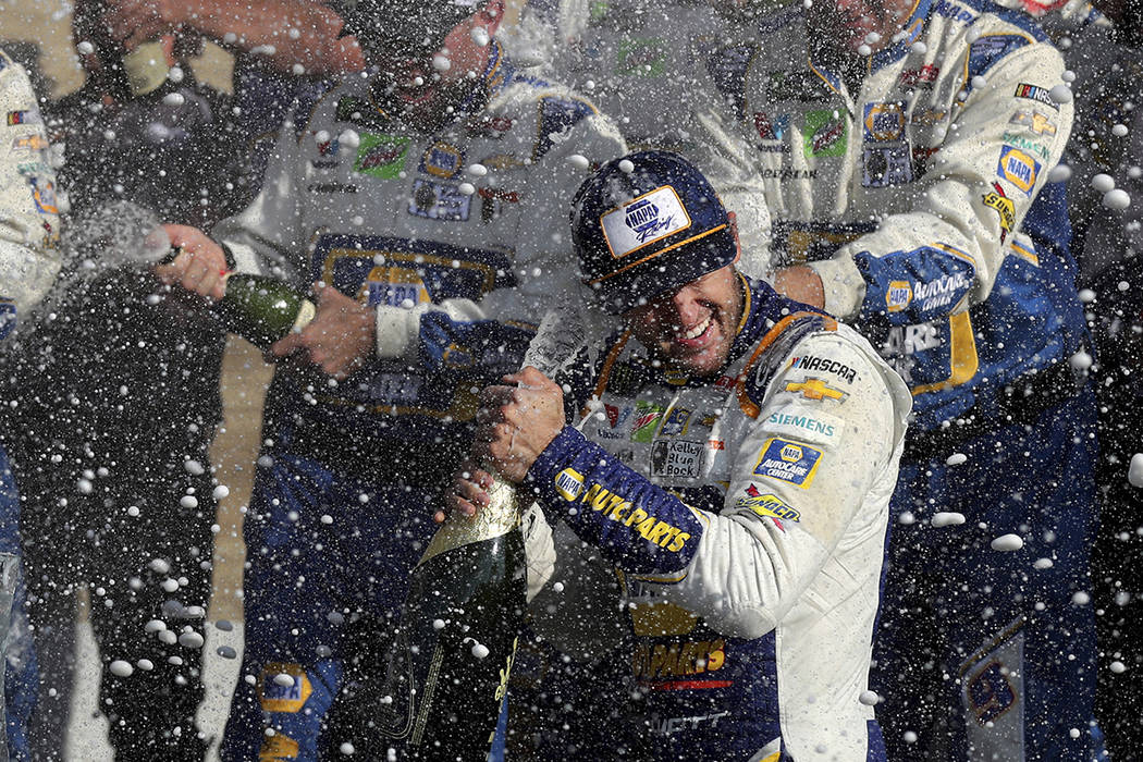 Chase Elliott celebrates his victory with his pit crew after winning a NASCAR Cup Series auto r ...