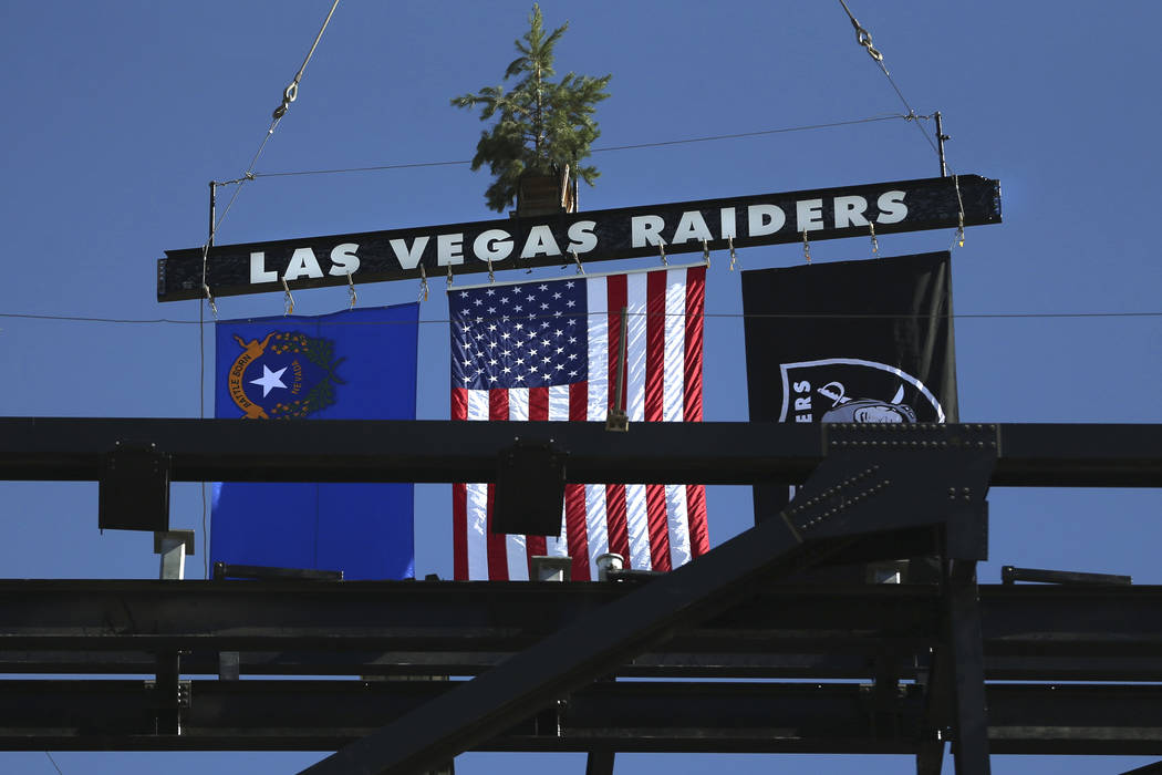 A steel beam is lifted during the Las Vegas Stadium Topping Out Ceremony in Las Vegas, Monday, ...