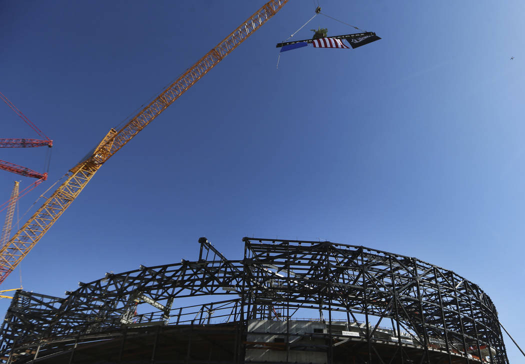 A steel beam is lifted during the Las Vegas Stadium Topping Out Ceremony in Las Vegas, Monday, ...