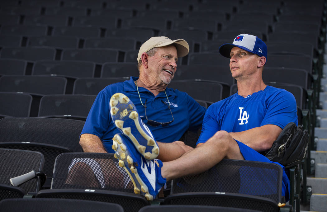 J.D. Martin, right, takes a moment out to visit with his father John Martin before his game wit ...