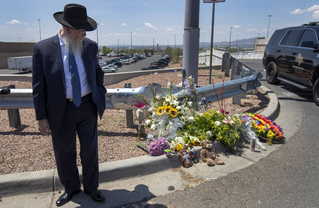 Rabbi Yisrael Greenberg looks at the makeshift memorial while paying tribute to the victims of ...