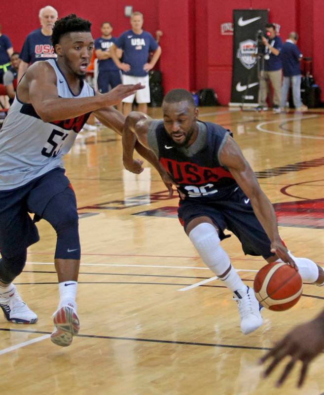 Jarrett Allen (36), of the Brooklyn Nets, dribbles past Donovan Mitchell (53), of Utah Jazz, du ...